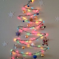 Christmas Tree Made Of Lights On Wall